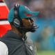 Jan 9, 2022; Miami Gardens, Florida, USA; Miami Dolphins head coach Brian Flores watches from the sideline during the second quarter against the New England Patriots at Hard Rock Stadium.